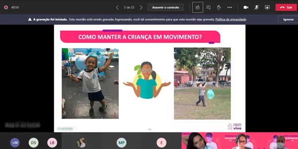 Tela mostra slide com fotos de duas crianças e o os dizeres “como manter a criança em movimento” durante oficina a distância na Escola Municipal República da Colômbia na Semana dos Voluntários.